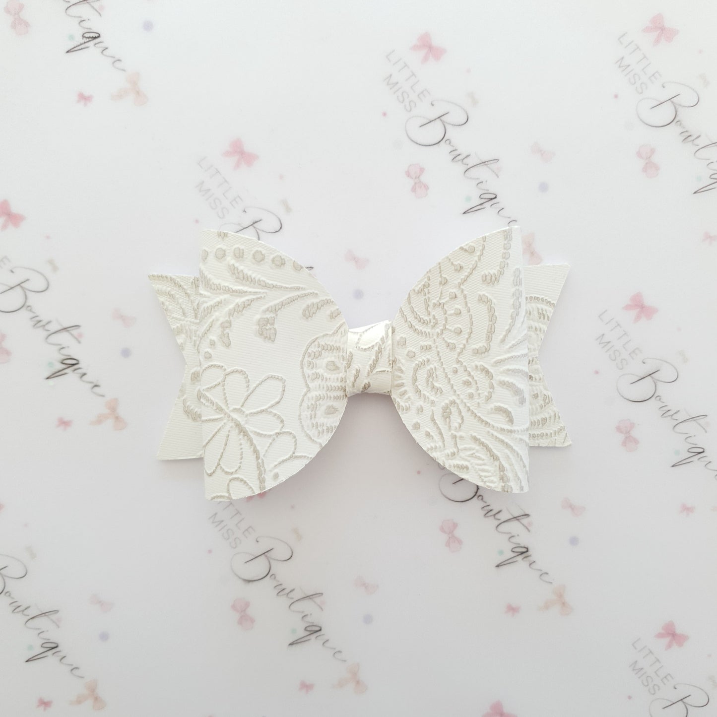 Embossed Faux Leather Bows