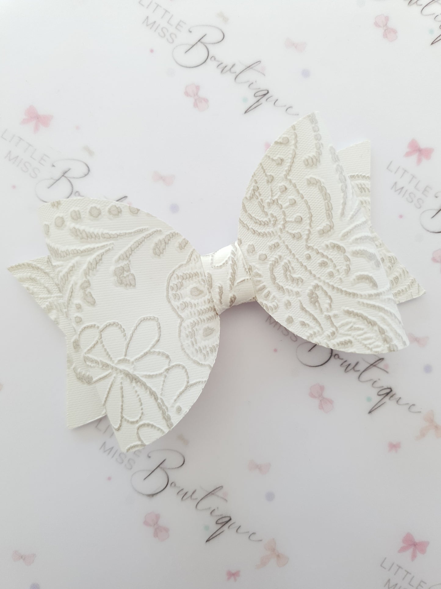 Embossed Faux Leather Bows