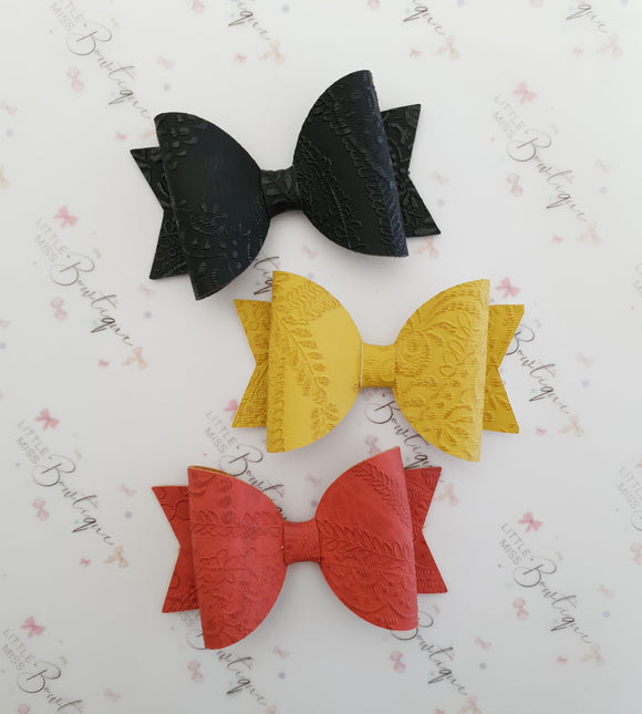 Embossed Faux Leather Bows