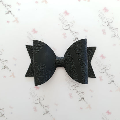 Embossed Faux Leather Bows