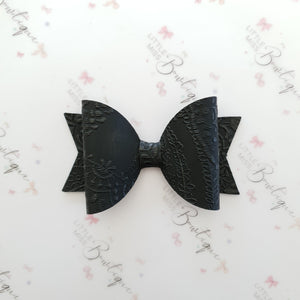 Embossed Faux Leather Bows
