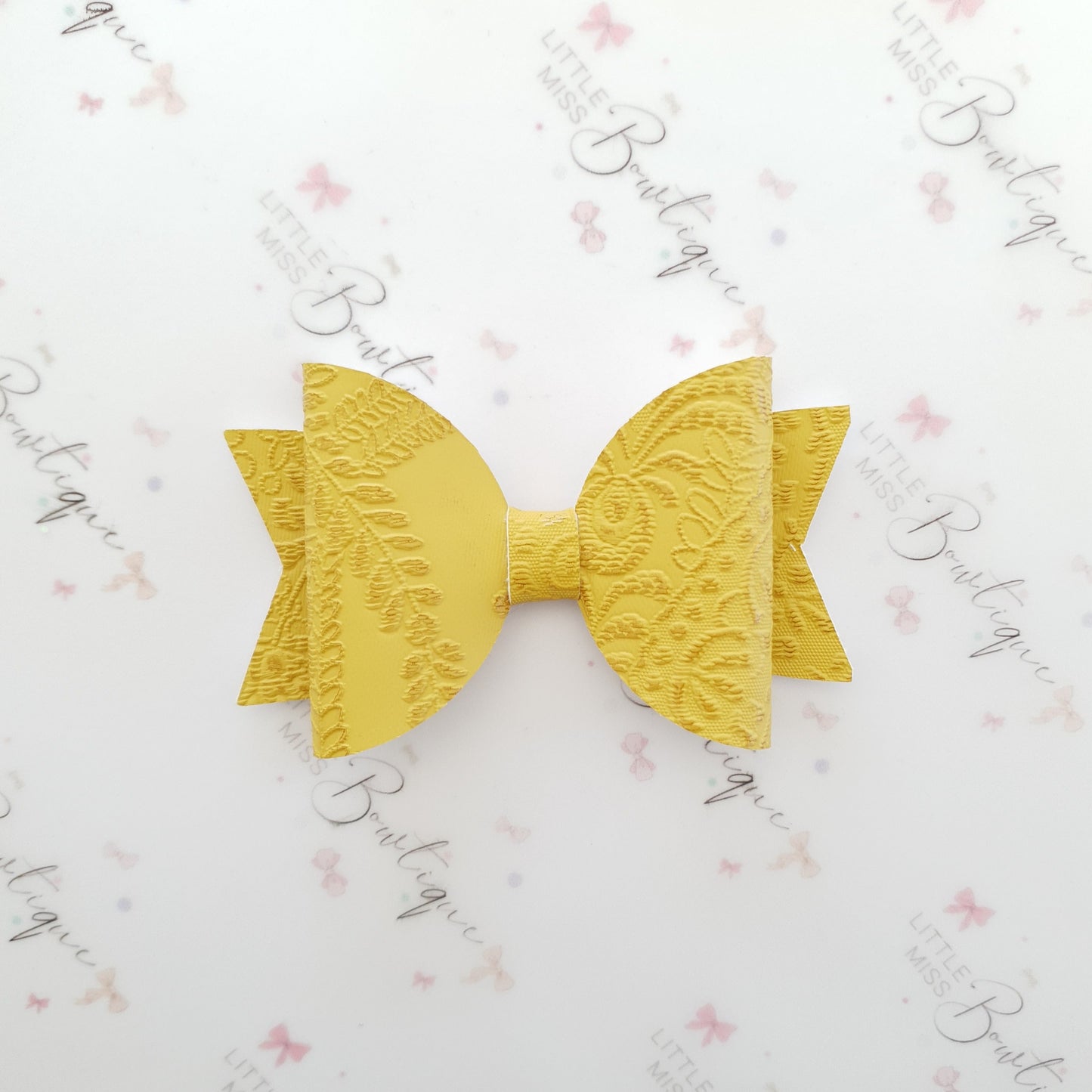 Embossed Faux Leather Bows